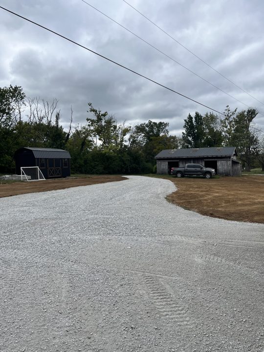 Finished gravel driveway approaching a home
