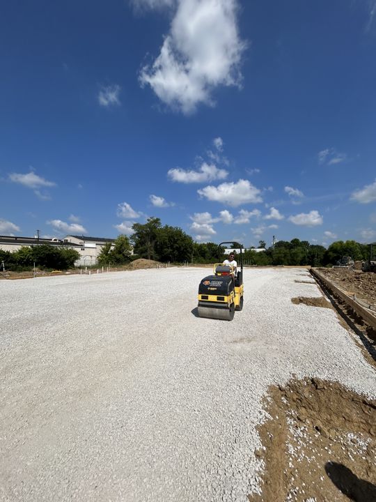 Compacting a gravel surface