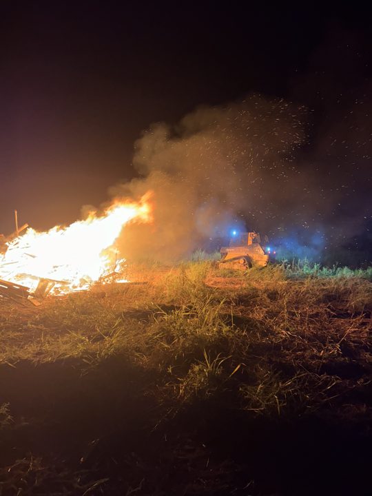 Brush pile burning at a job site