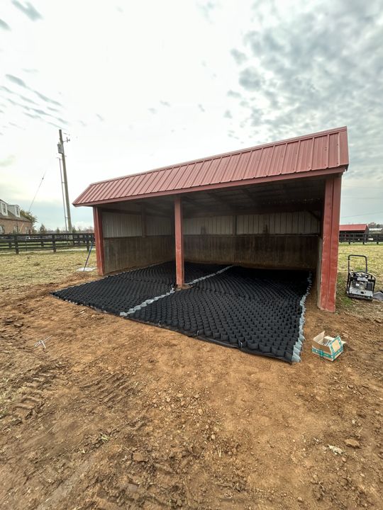 Base preparation beside an outbuilding