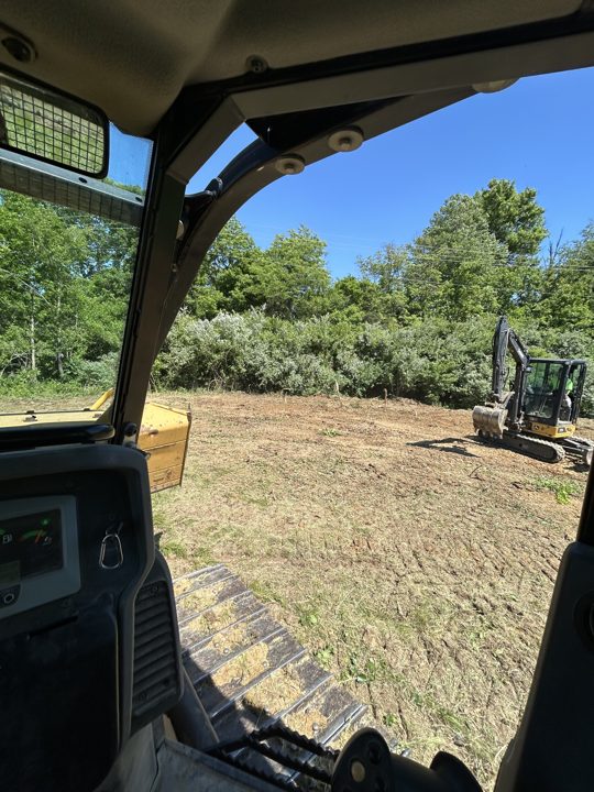 Cleared ground viewed from the equipment cab