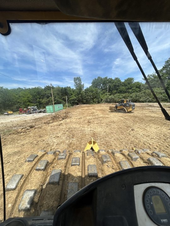 Site grading viewed from the equipment cab
